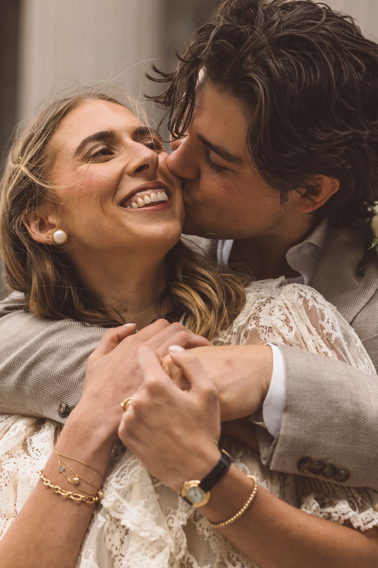 cute picture of the groom kissing the bride on the cheek