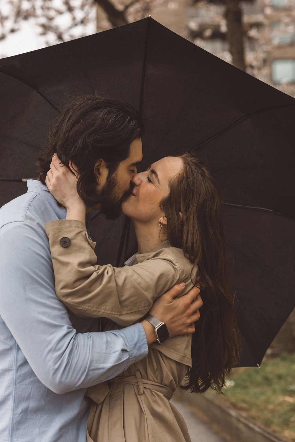 newly engaged couple kissing during their photoshoot