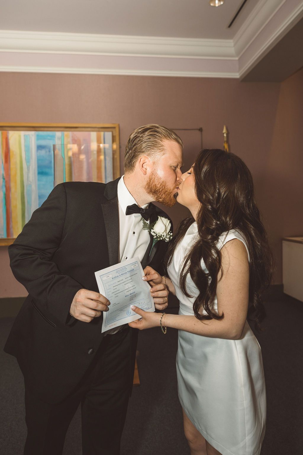 cute picture of the bride and groom kissing after their ceremony