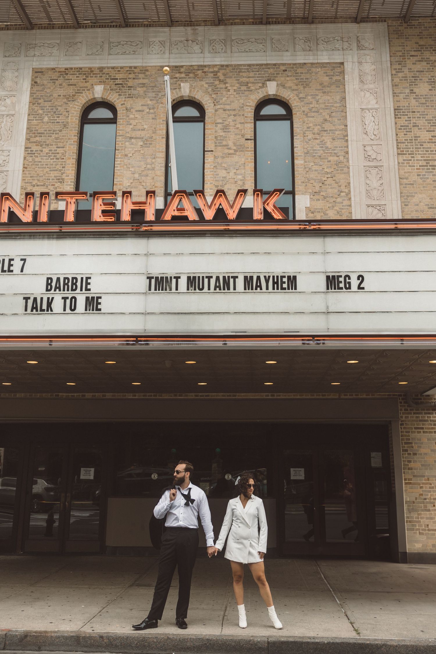 cute picture of the newly engaged couple at the theater