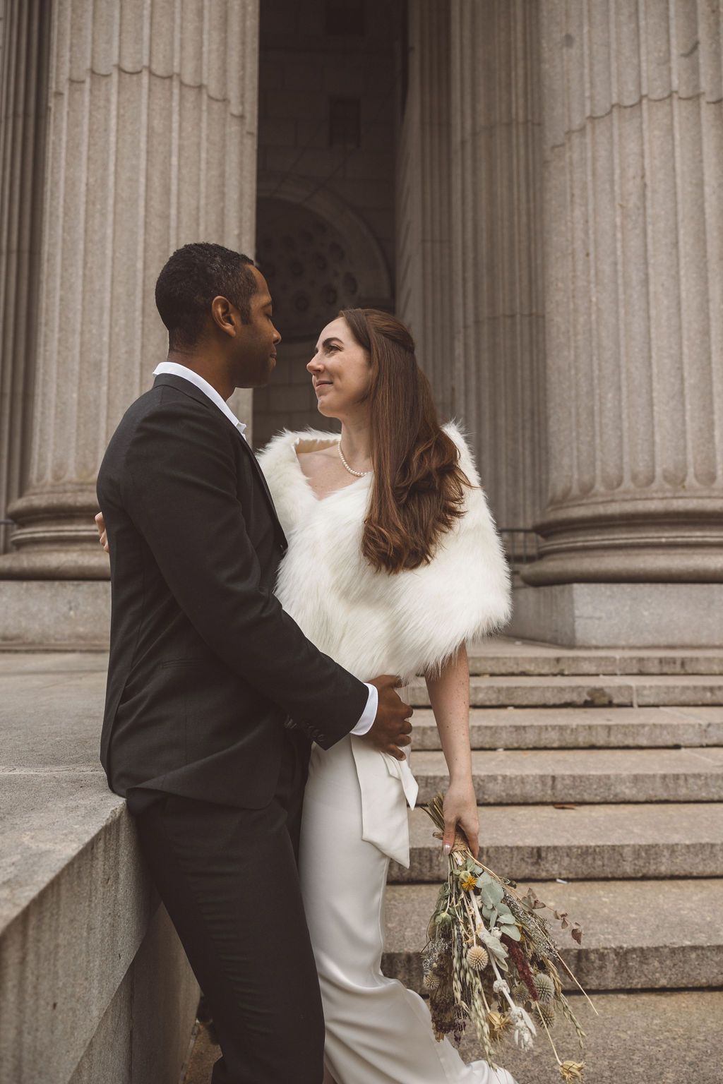 cute picture of the bride and groom smiling at each other