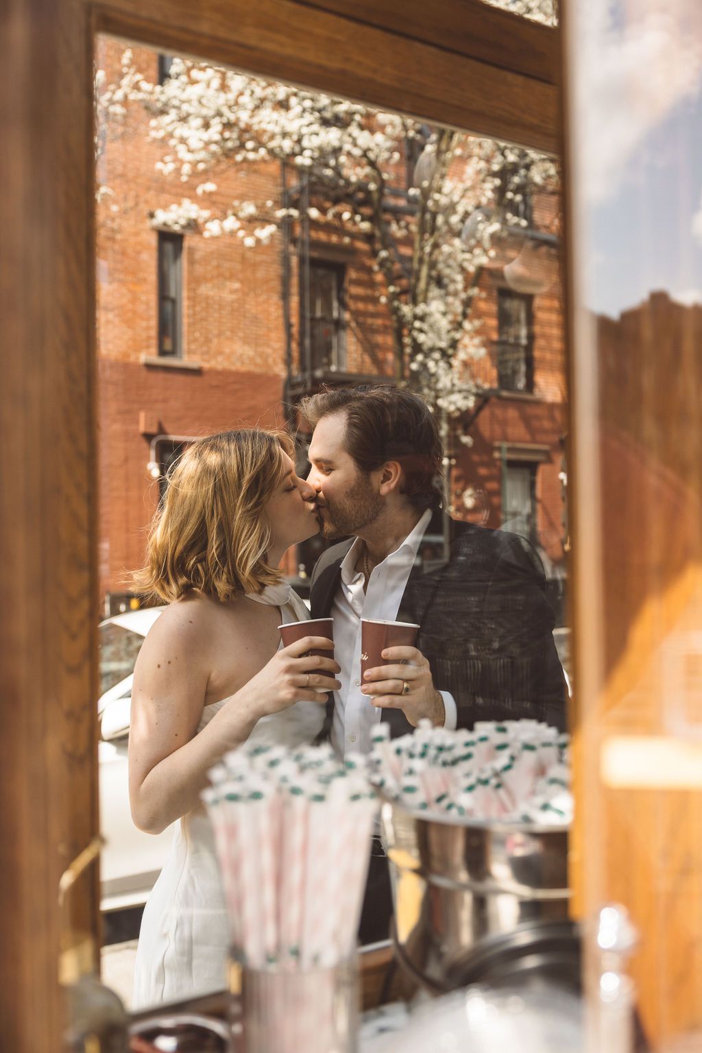 cute picture of the couple kissing during their photoshoot