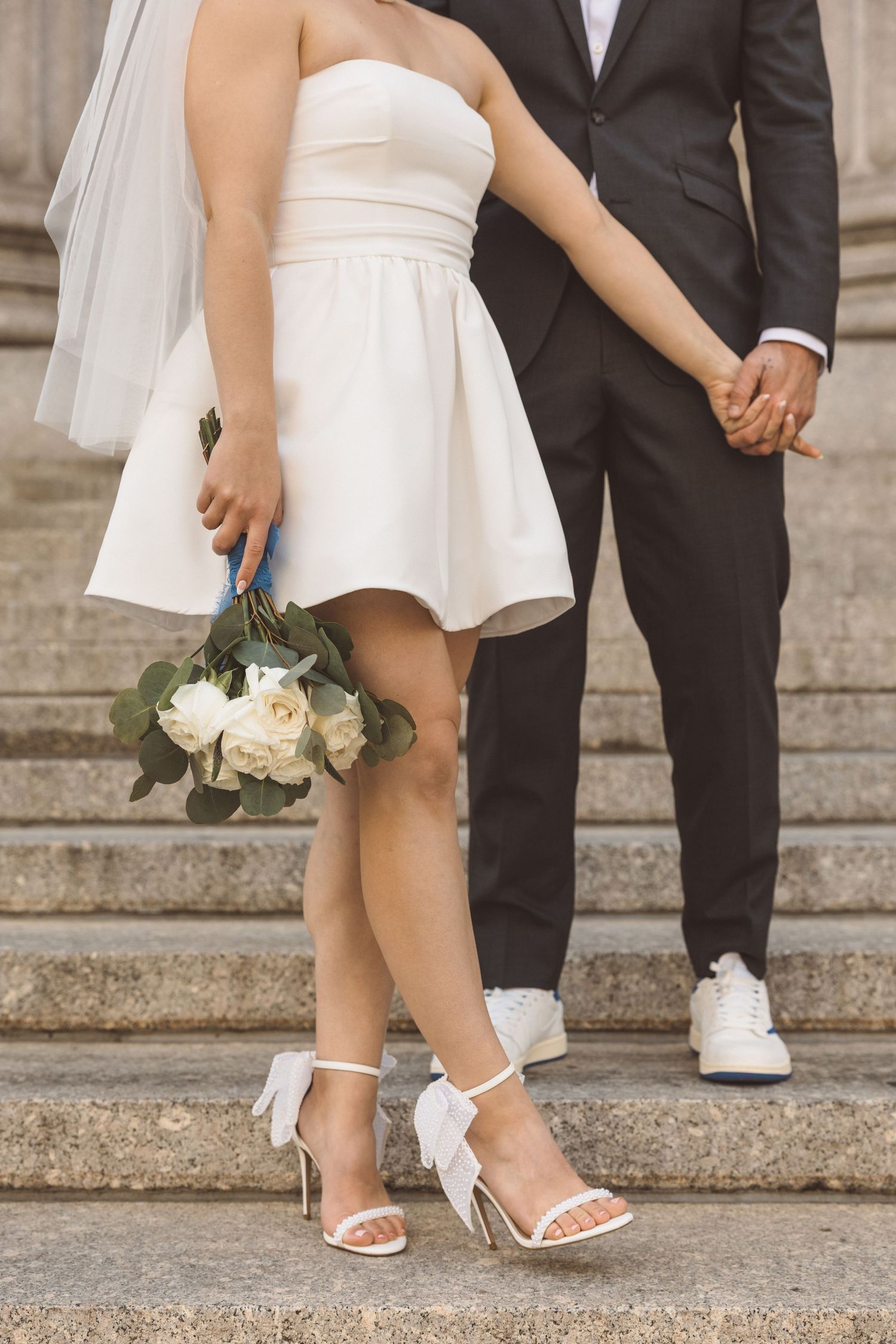 Cute picture of the bride and groom holding hands