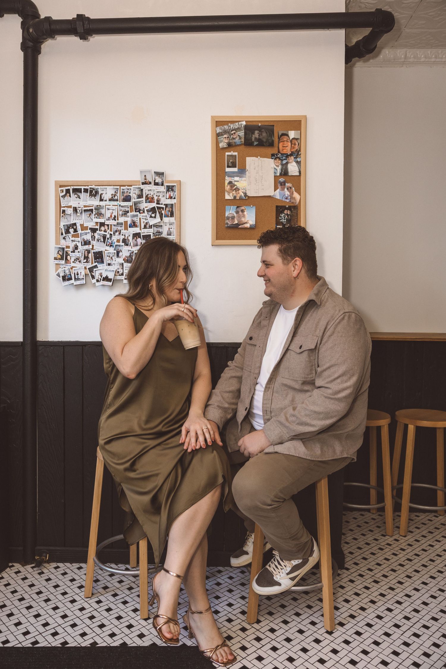 portrait of the newly engaged couple laughing with each other