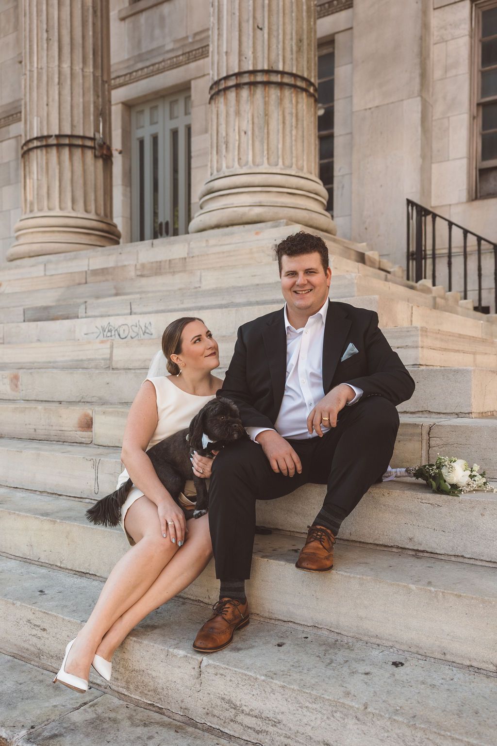 bride and groom laughing with each other during their session