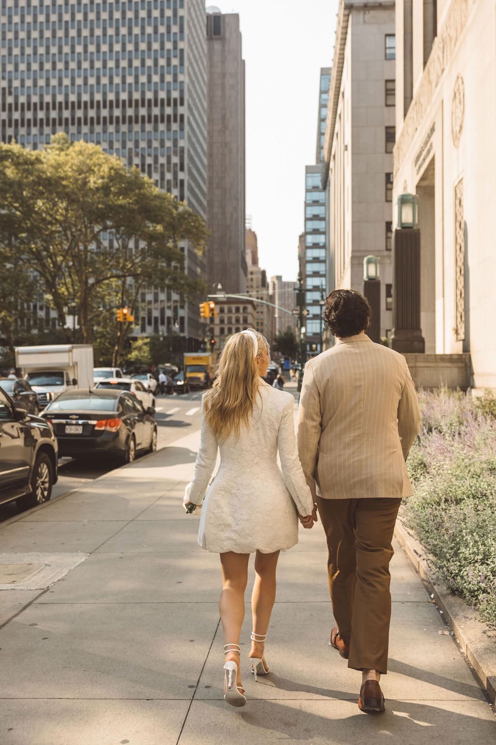 couple walking around NYC after their elopement ceremony