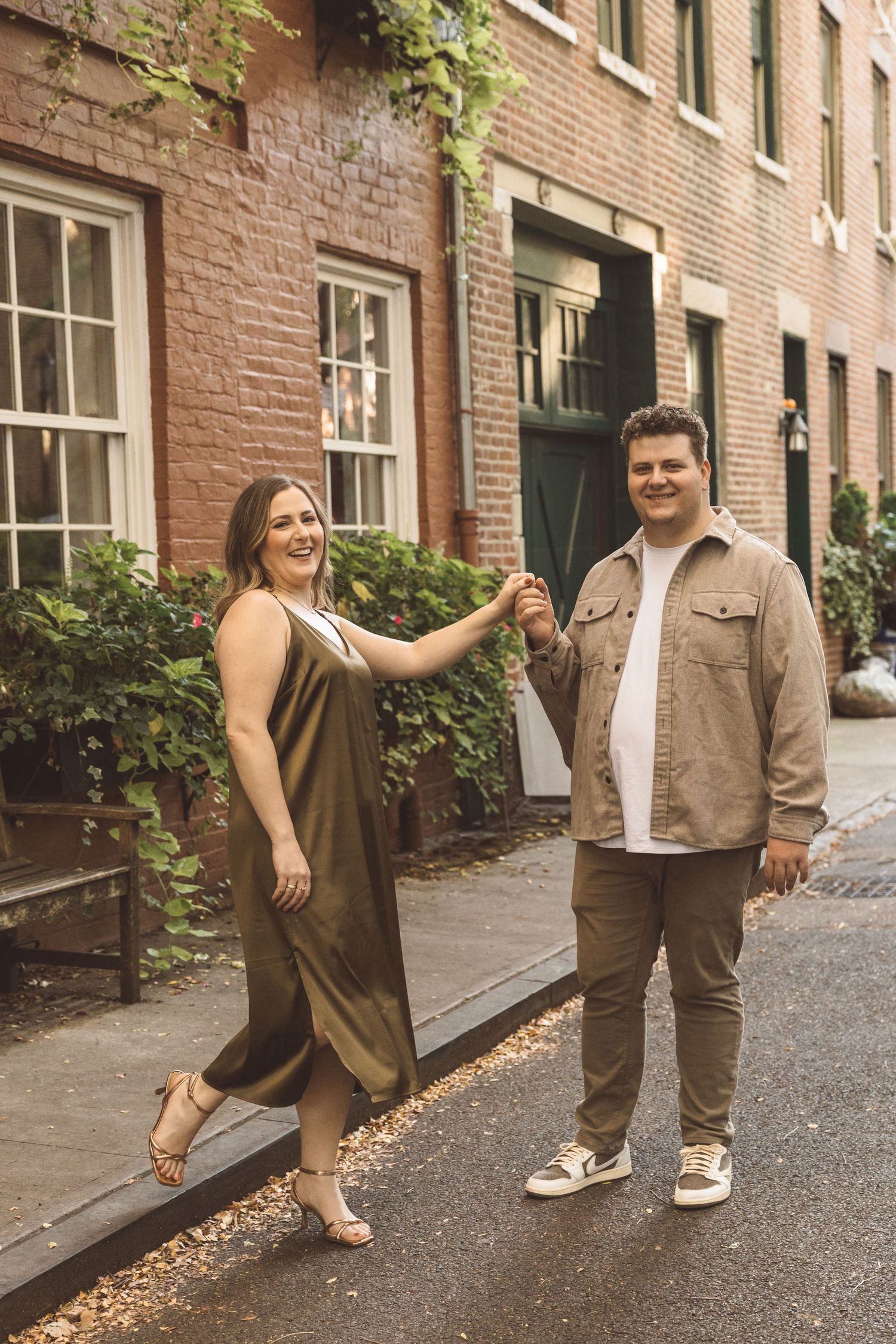 cute picture of the newly engaged couple holding hands