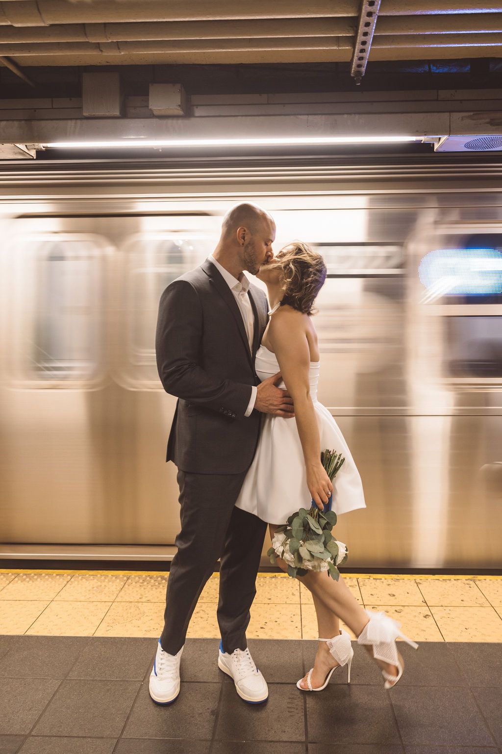 couple kissing on the subway