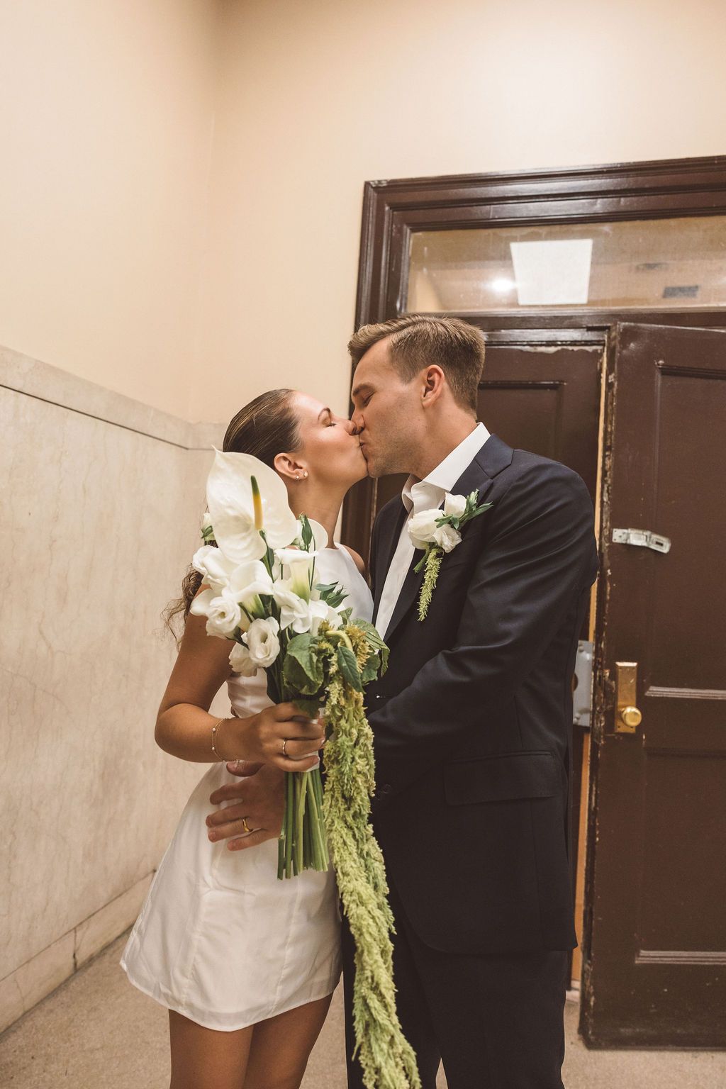cute picture of the newlyweds kissing