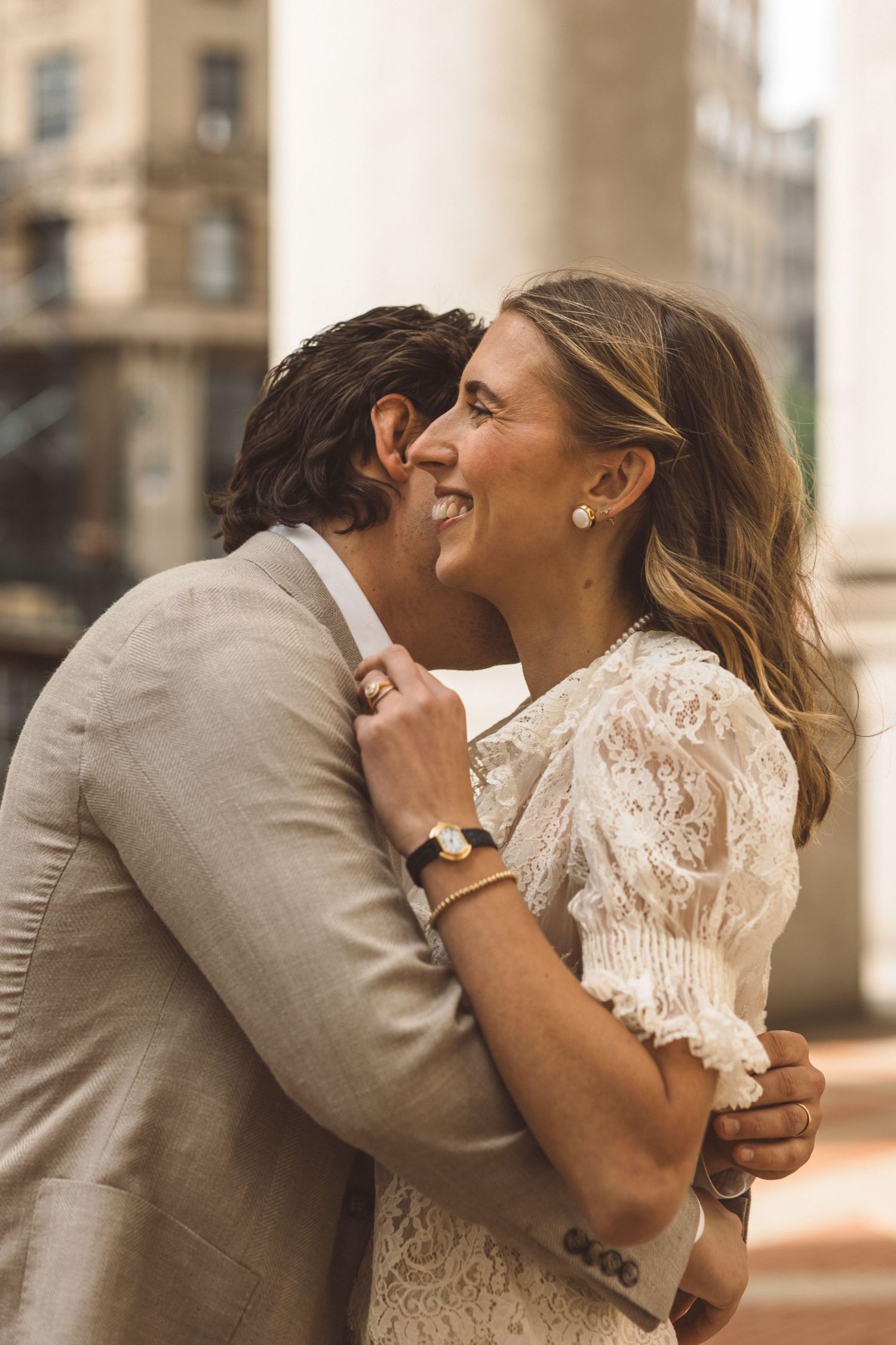 picture of the groom kissing the bride on the cheek