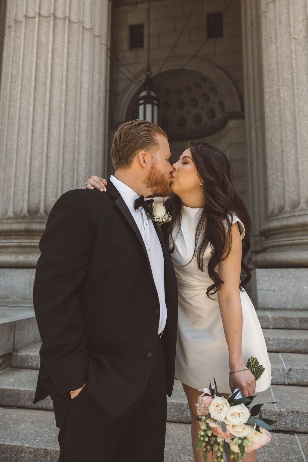 cute picture of the bride and groom kissing