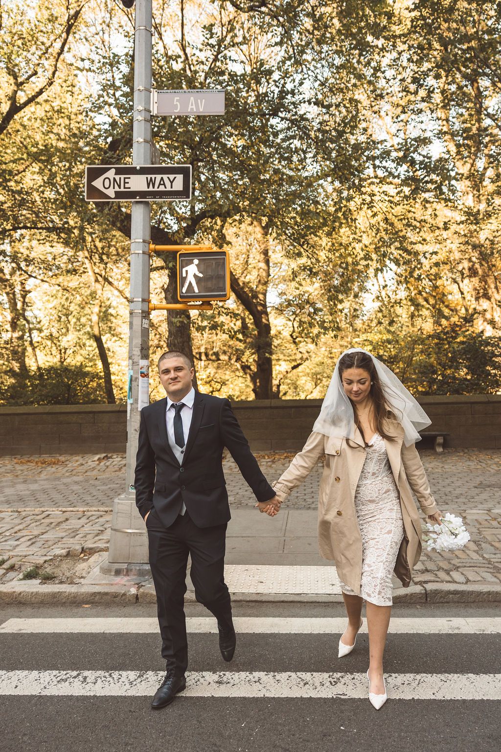 couple walking around NYC during their bridal photos