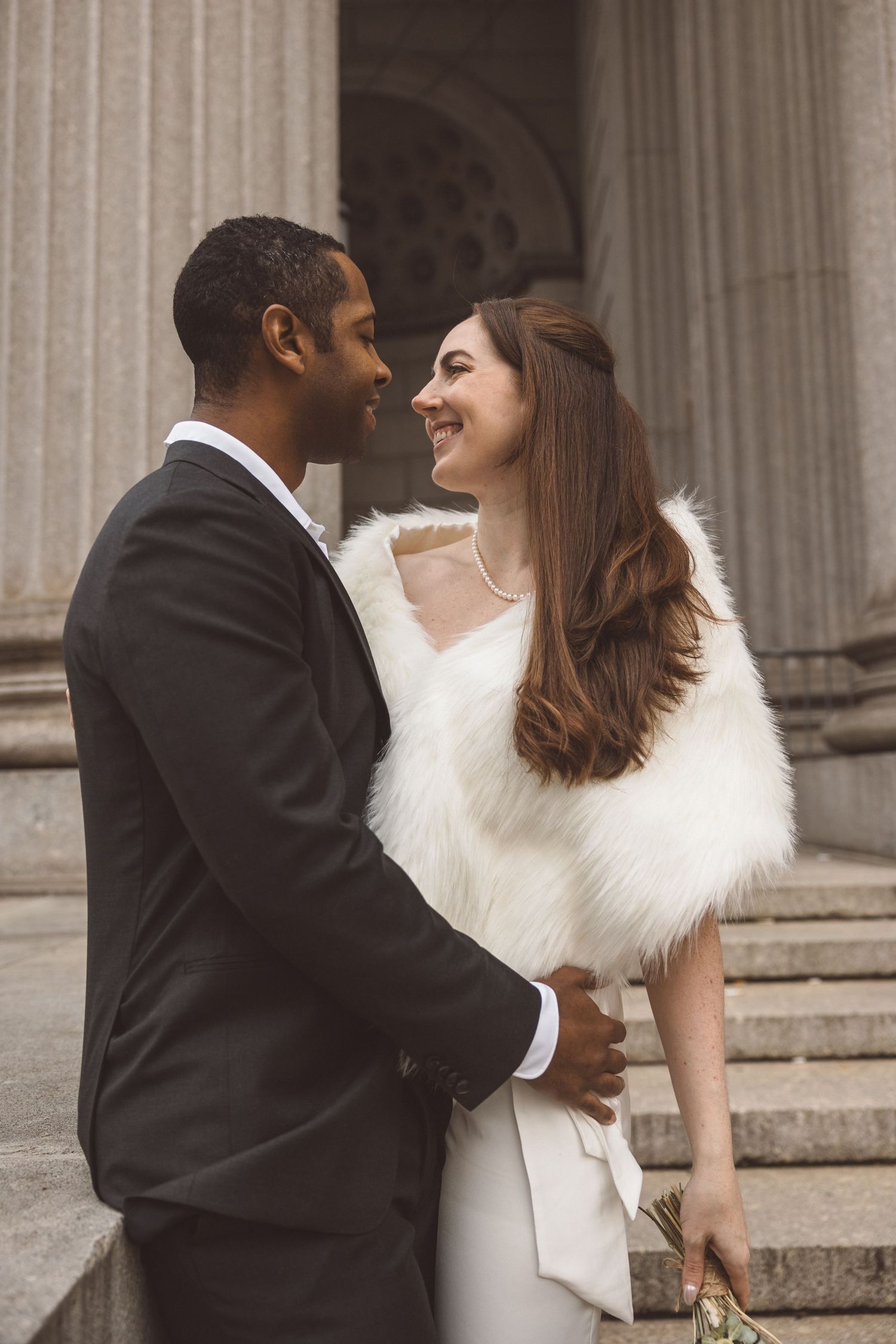 Cute picture of the bride and groom, smiling at each other