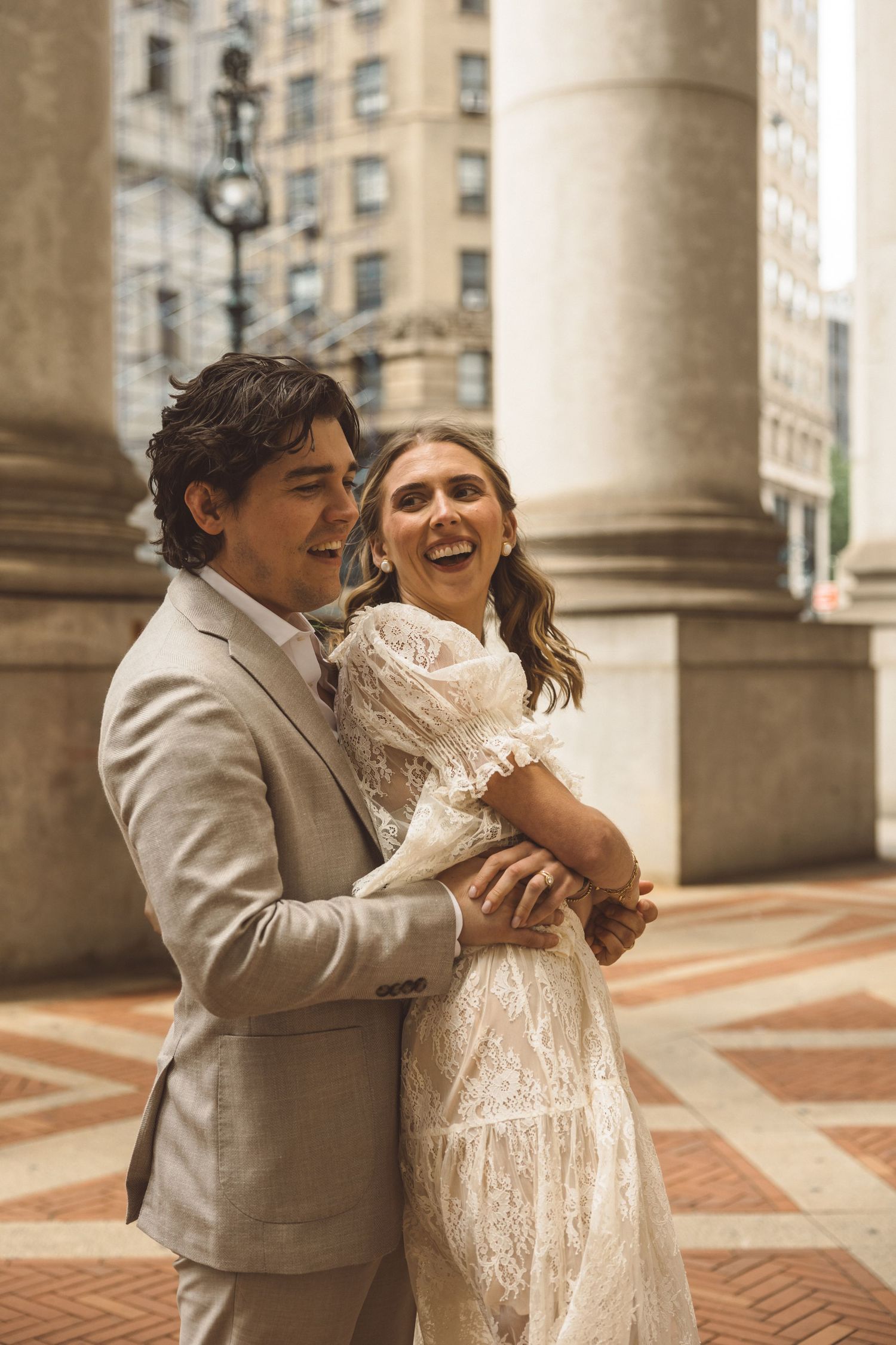 newly married couple at their playful bridal portraits