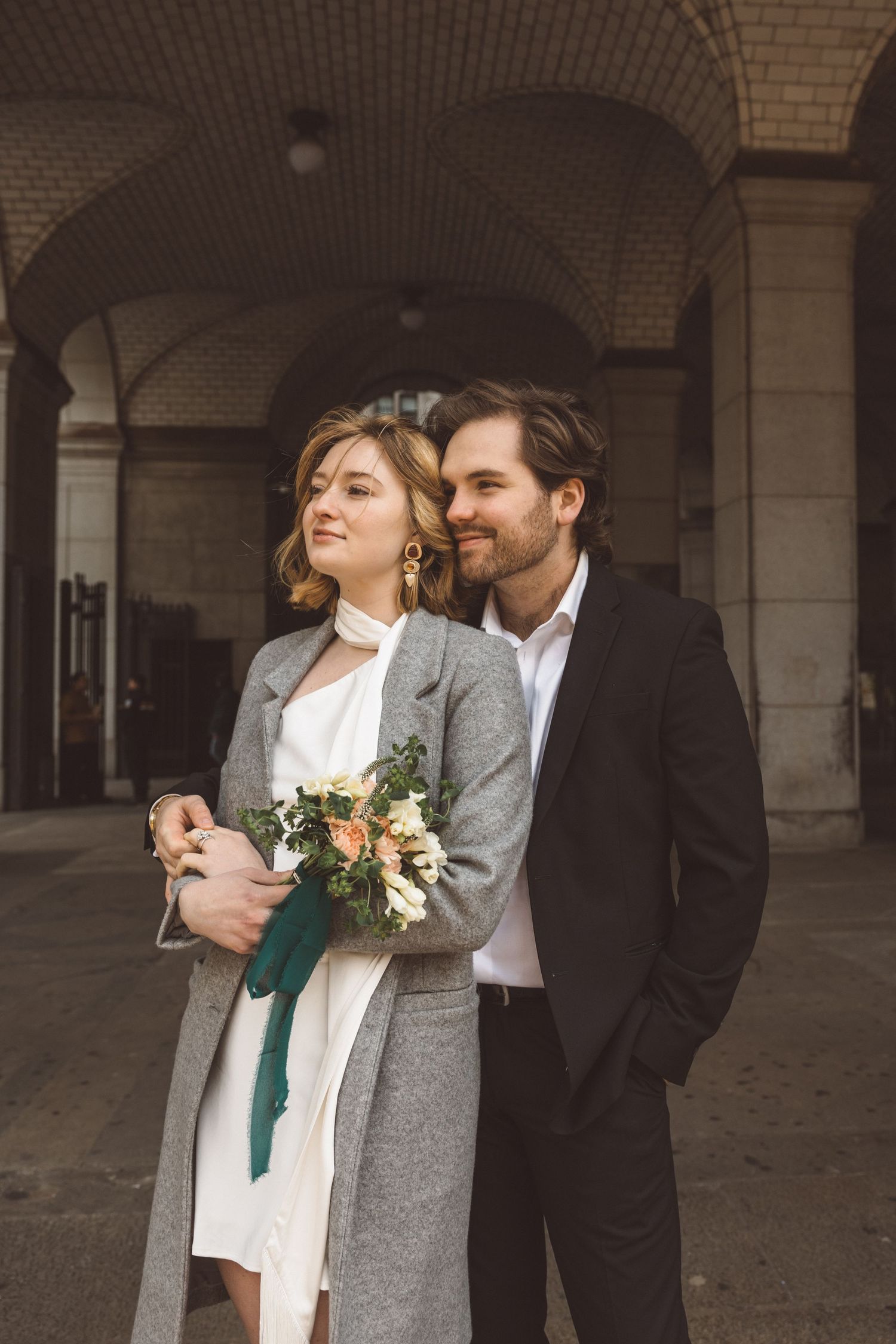 oyful newlyweds at Dinkins Municipal Building after civil ceremony at NYC City Hall