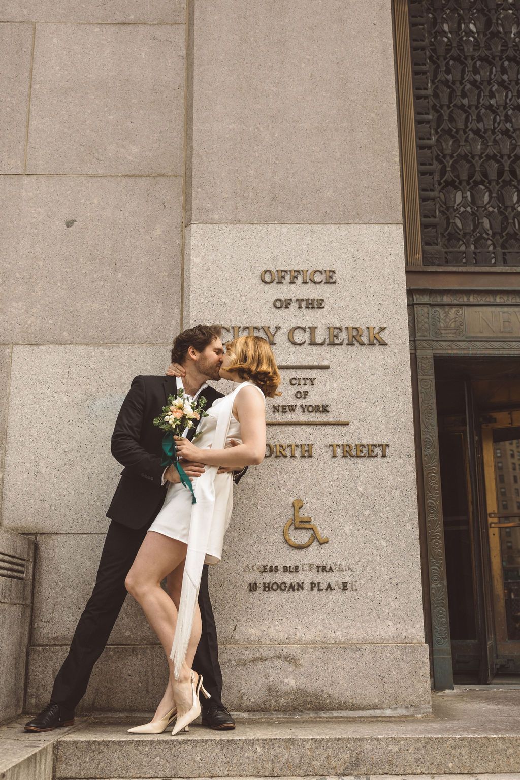 cute picture of the newlyweds kissing