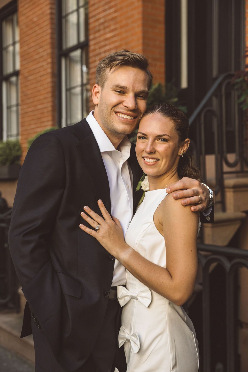 couple smiling at the camera during their photoshoot