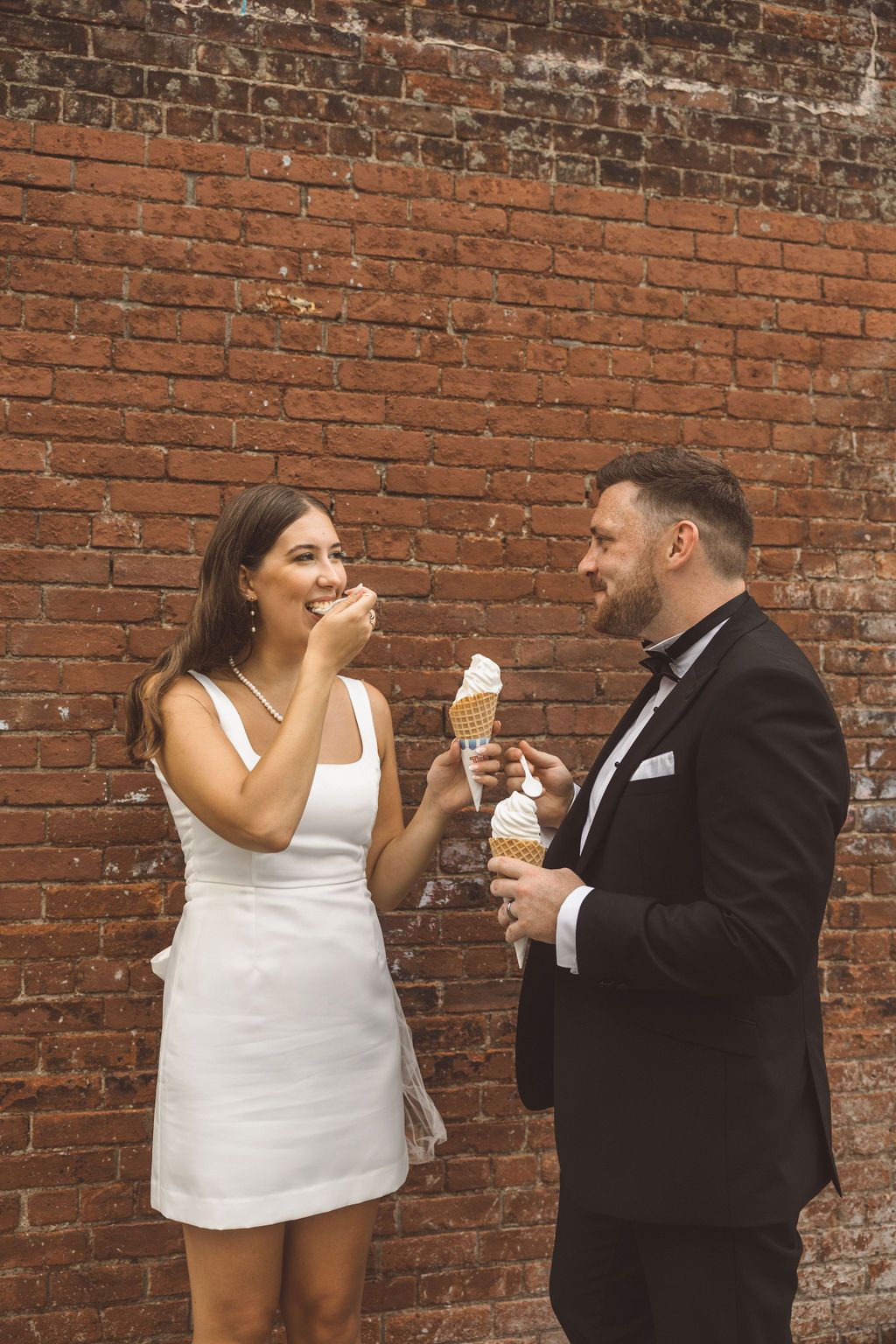 cute picture of the newlyweds celebrating their elopement with ice cream