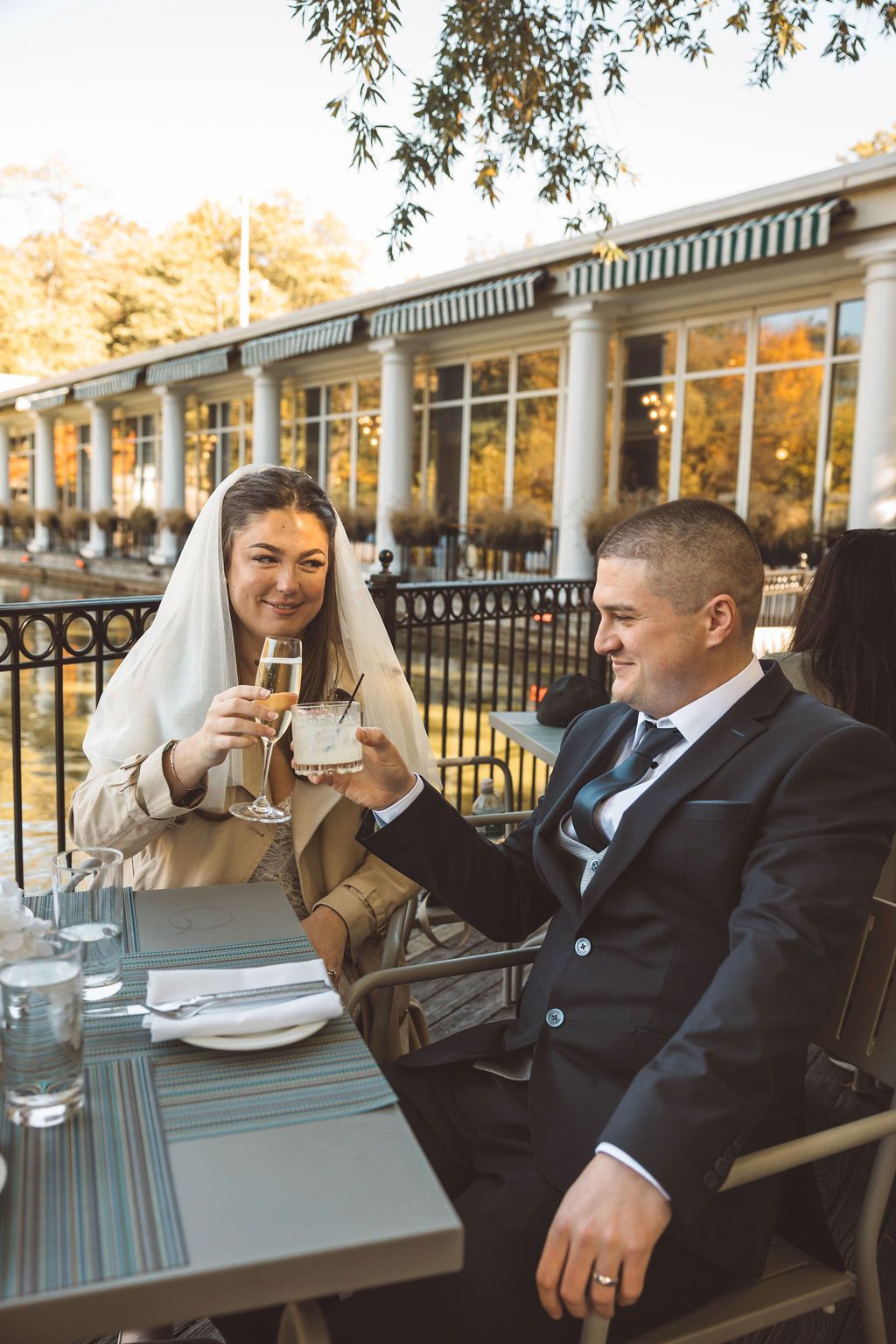 newlyweds celebrating their elopement with some drinks