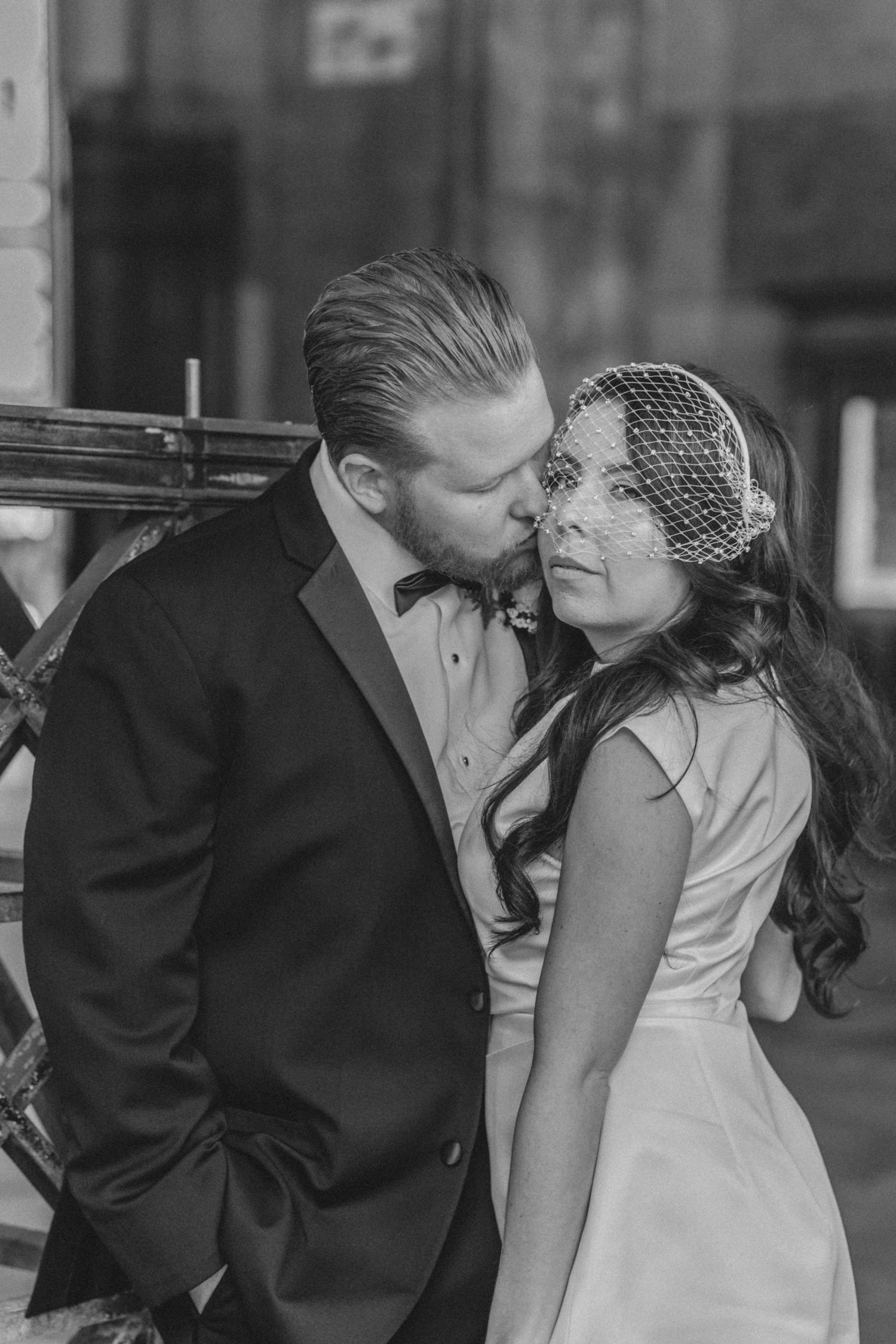 Black and white photo of couple sharing an intimate moment after NYC City Hall elopement