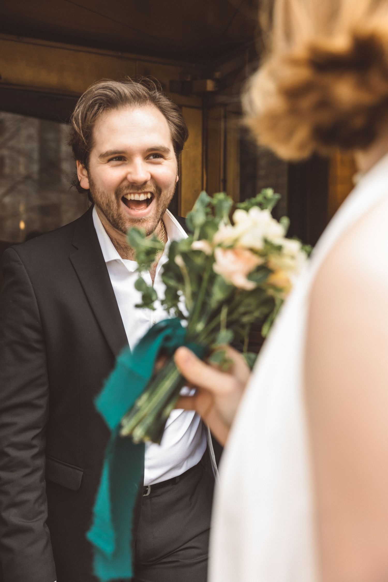 Couple exiting NYC City Hall after their civil wedding ceremony