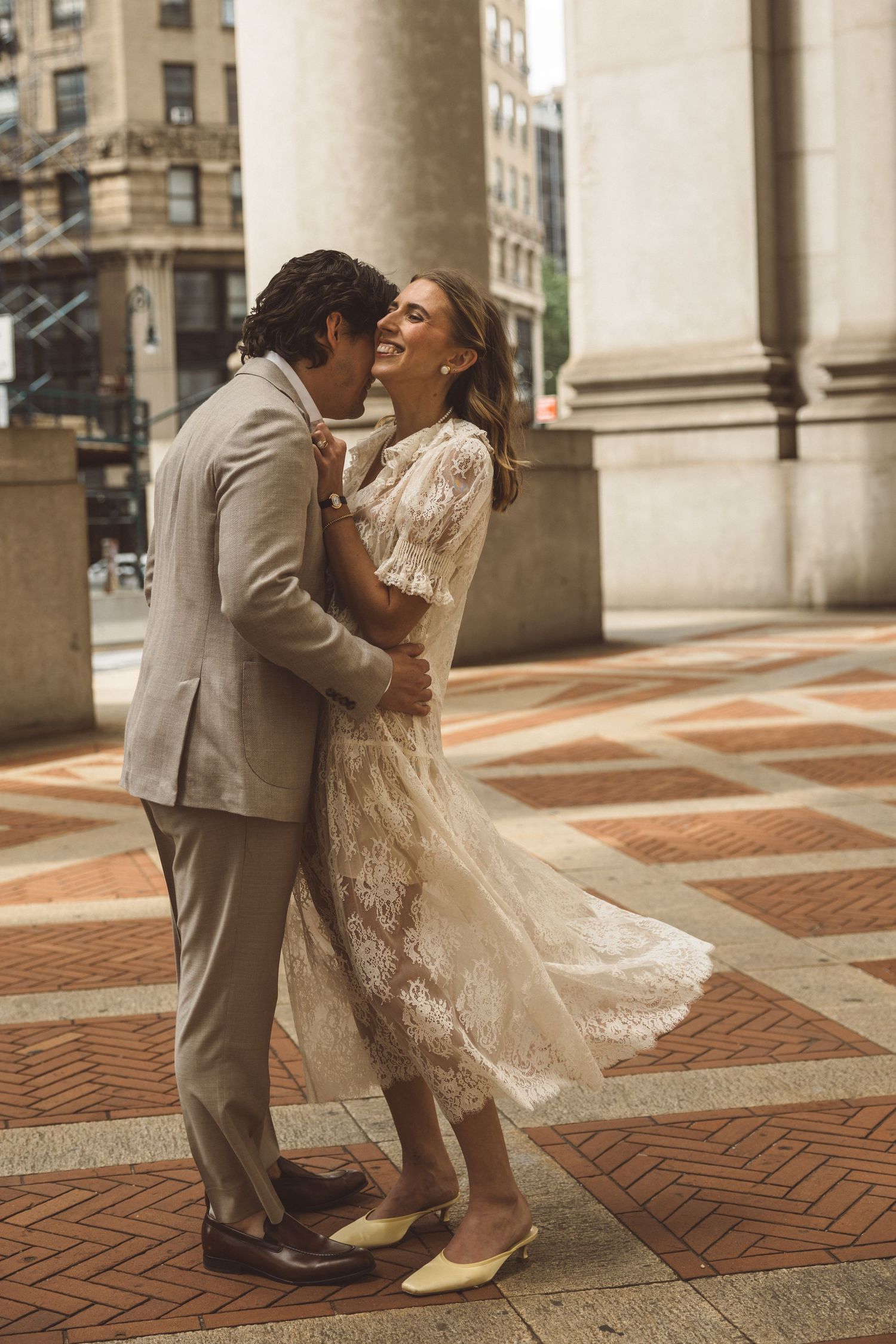 newlyweds dancing during their photoshoot