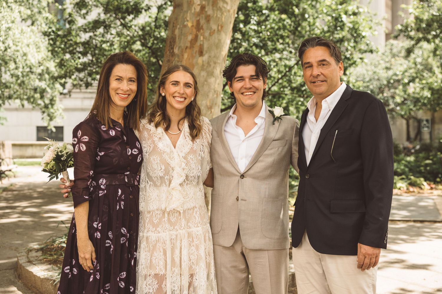 cute picture of the newlyweds with their family