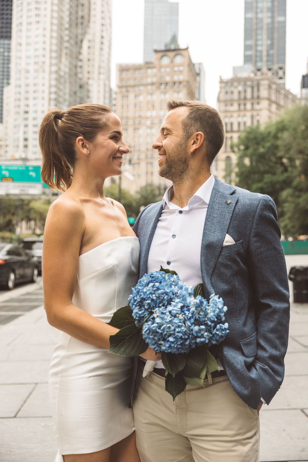 couple smiling at the camera during their photoshoot
