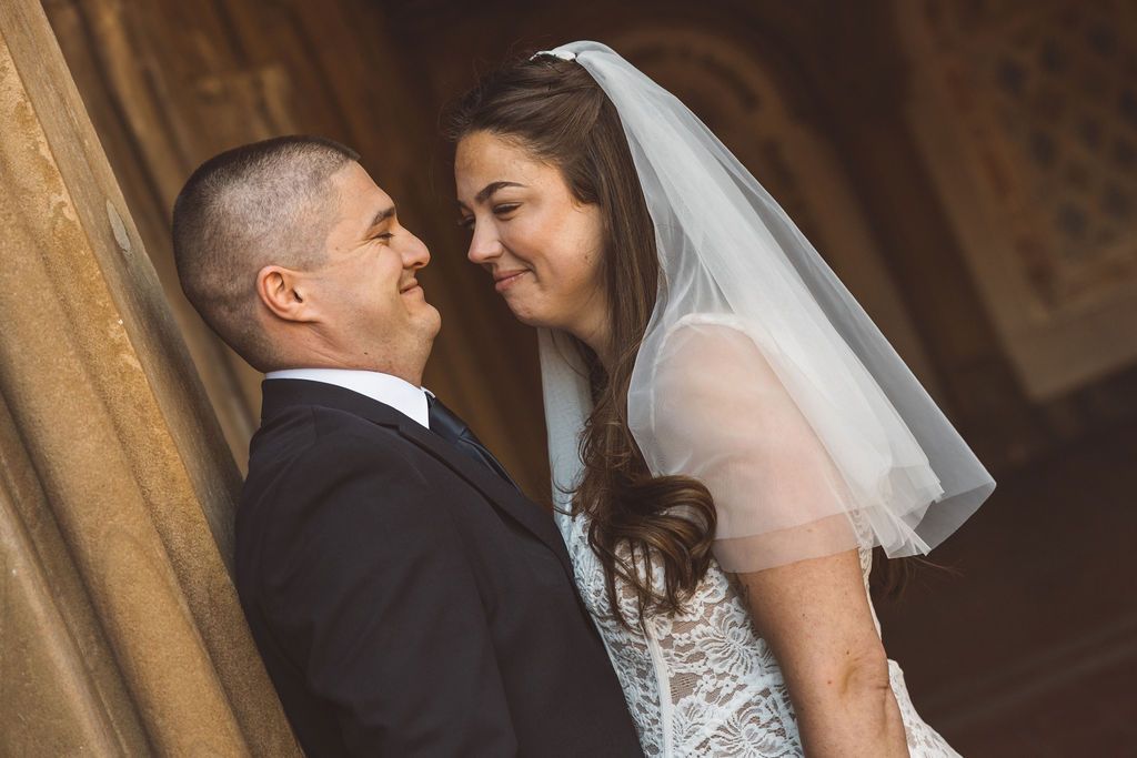 cute picture of the newlyweds smiling at each other