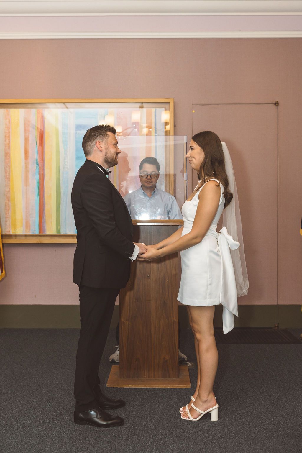 bride and groom holding hands during their ceremony