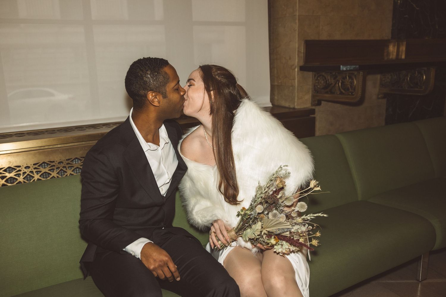 Picture of the bride and groom, kissing before their ceremony