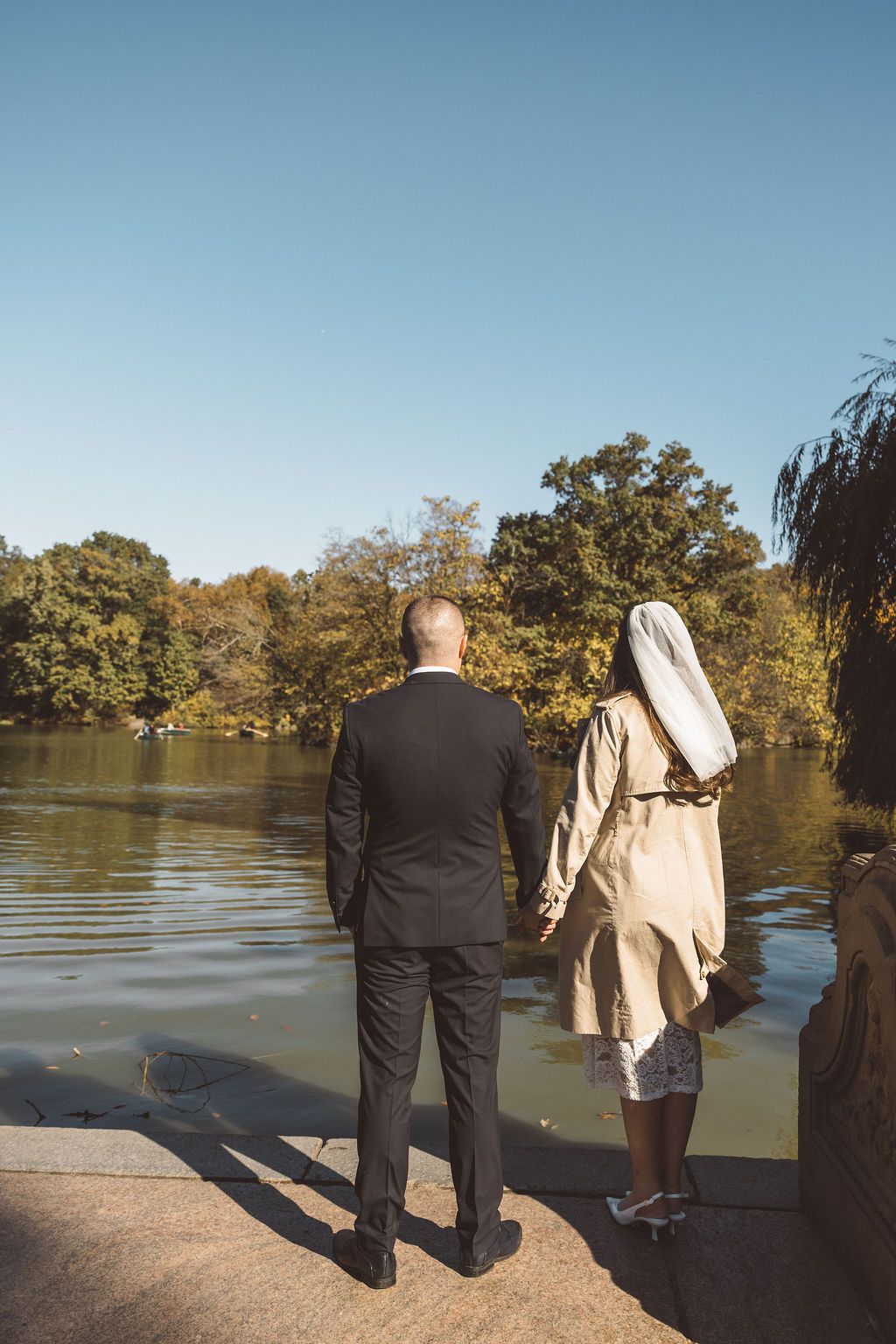 portrait of the newlyweds holding hands