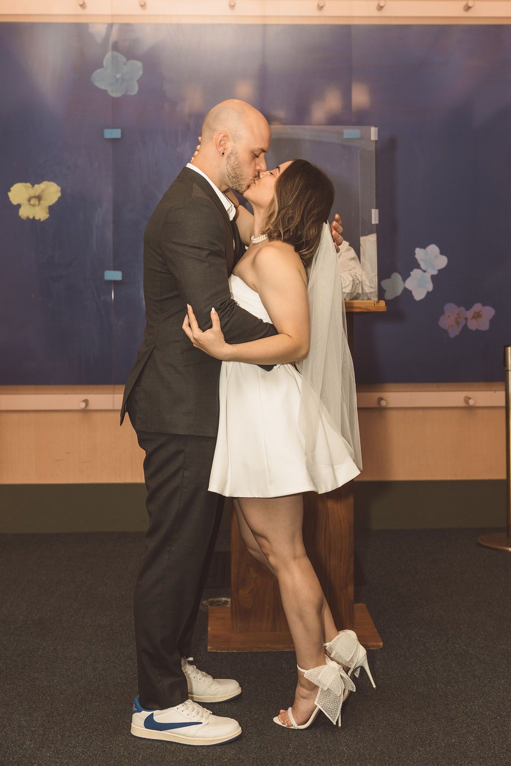 portrait of the bride and groom kissing after their ceremony