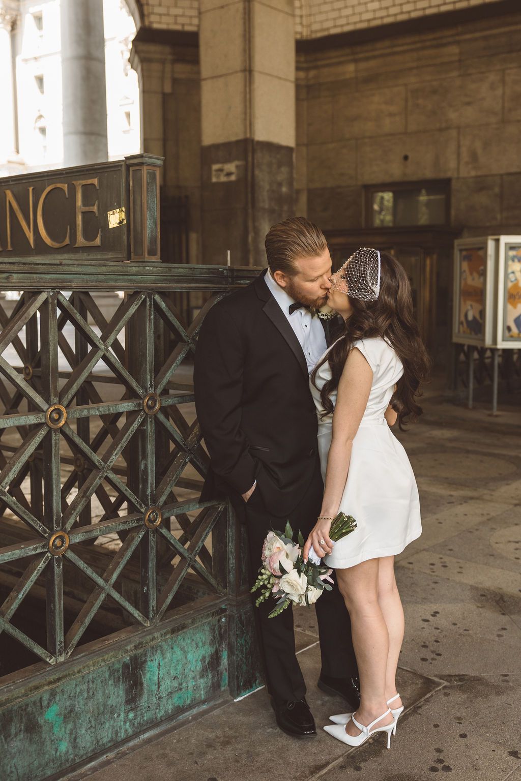 portrait of the newlyweds kissing