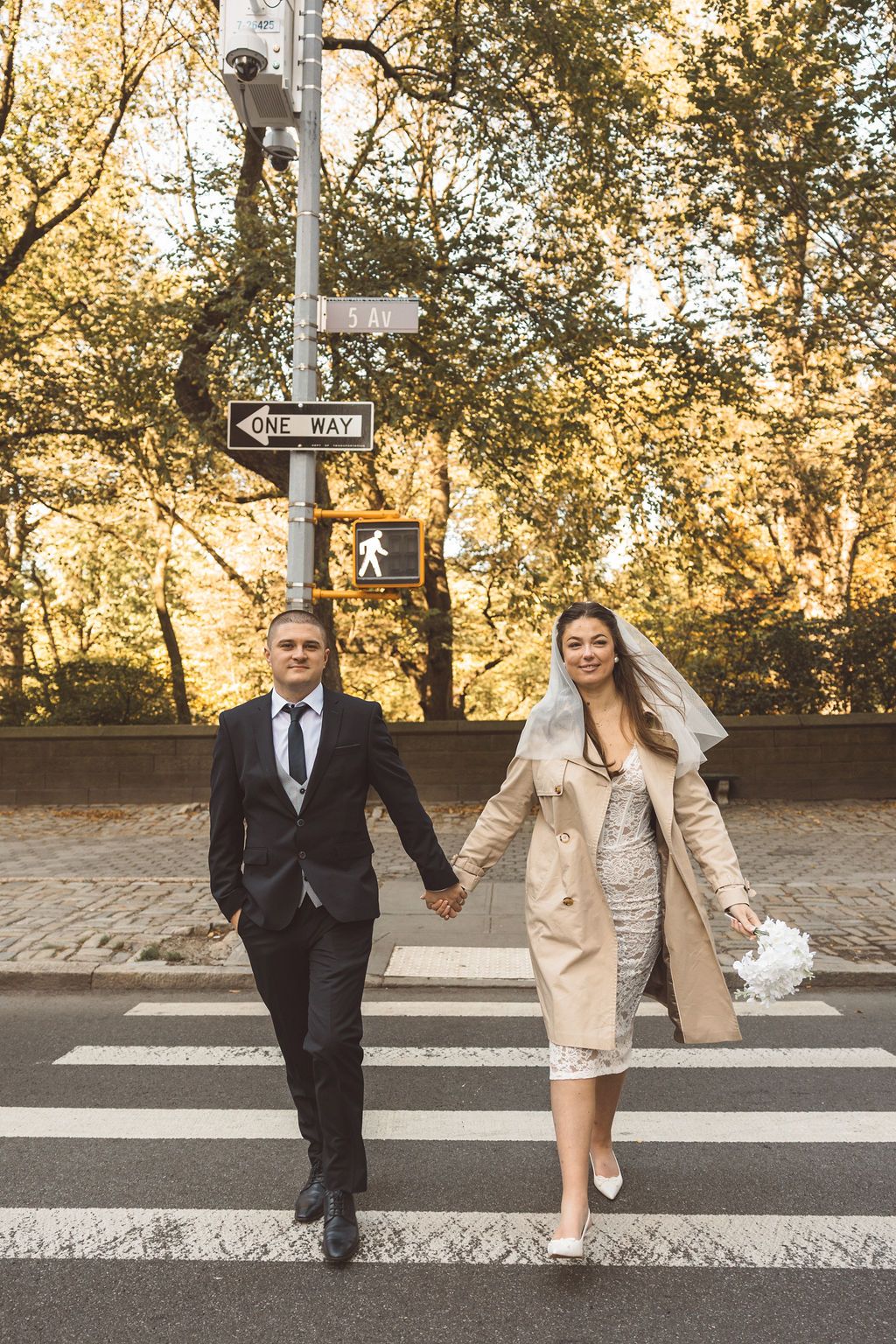 couple walking around NYC during their photoshoot