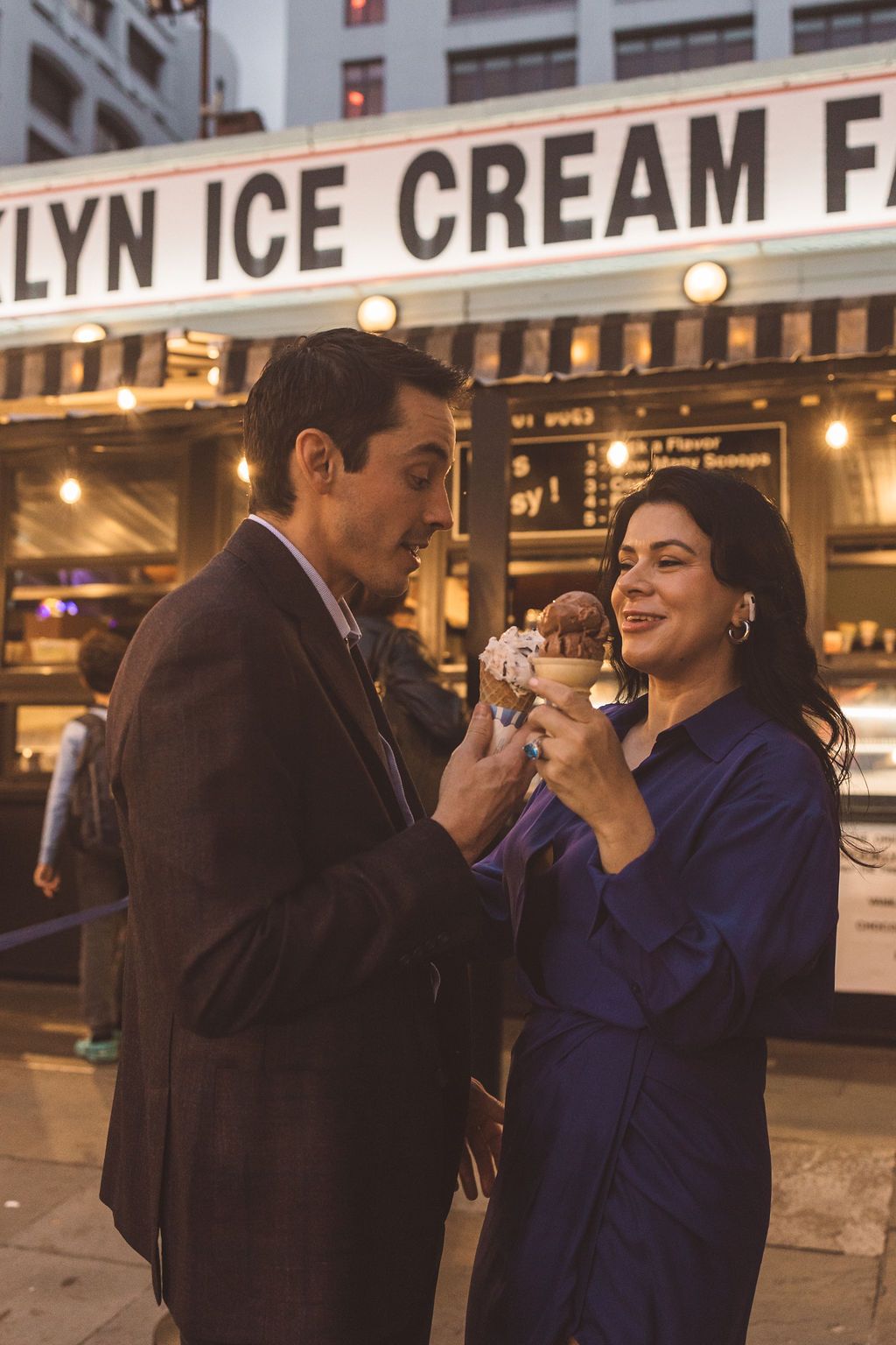 couple celebrating their engagement with ice cream
