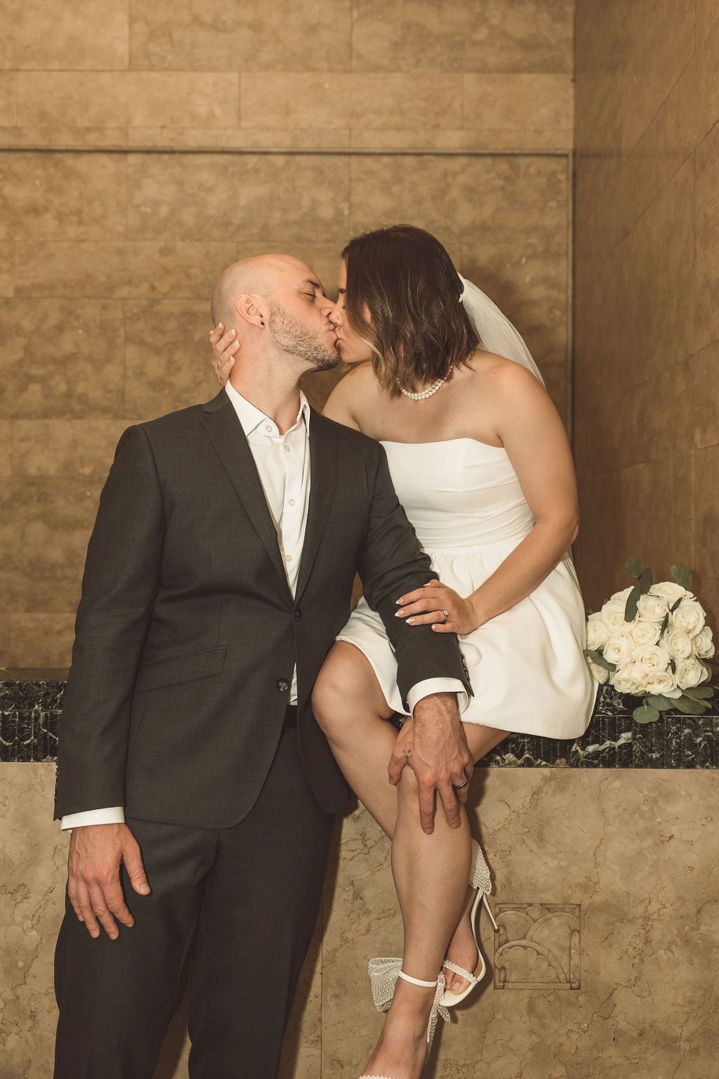cute picture of the newly married couple kissing