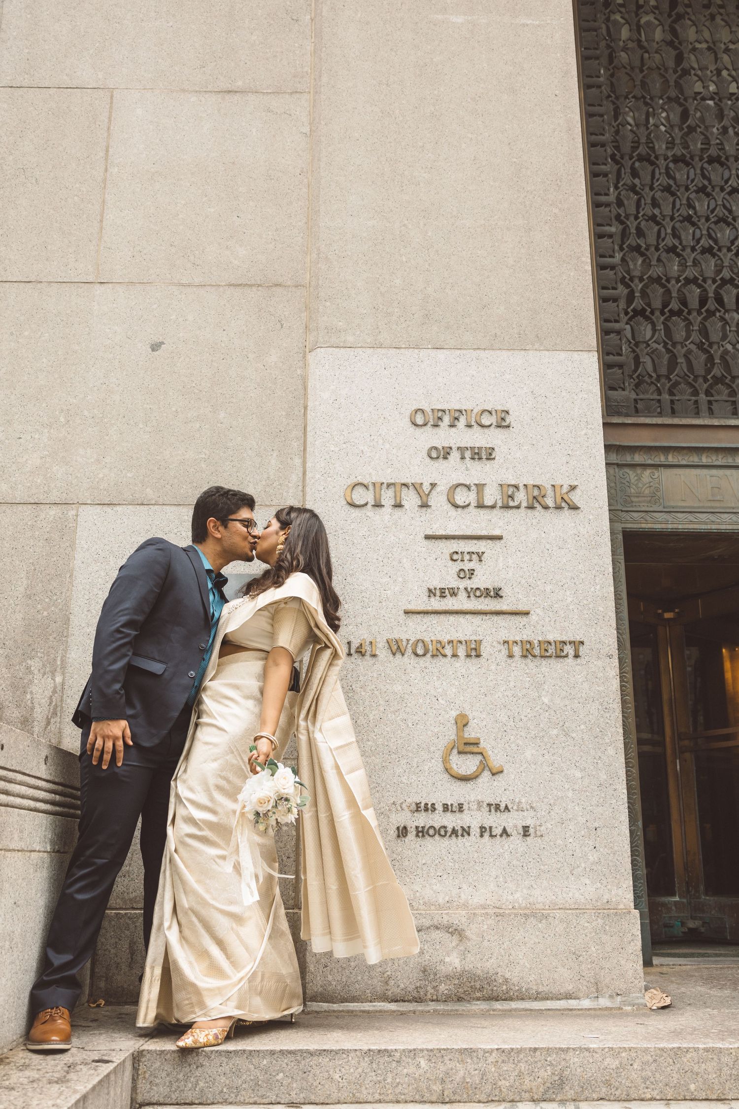 Newly married couple celebrating outside Manhattan courthouse