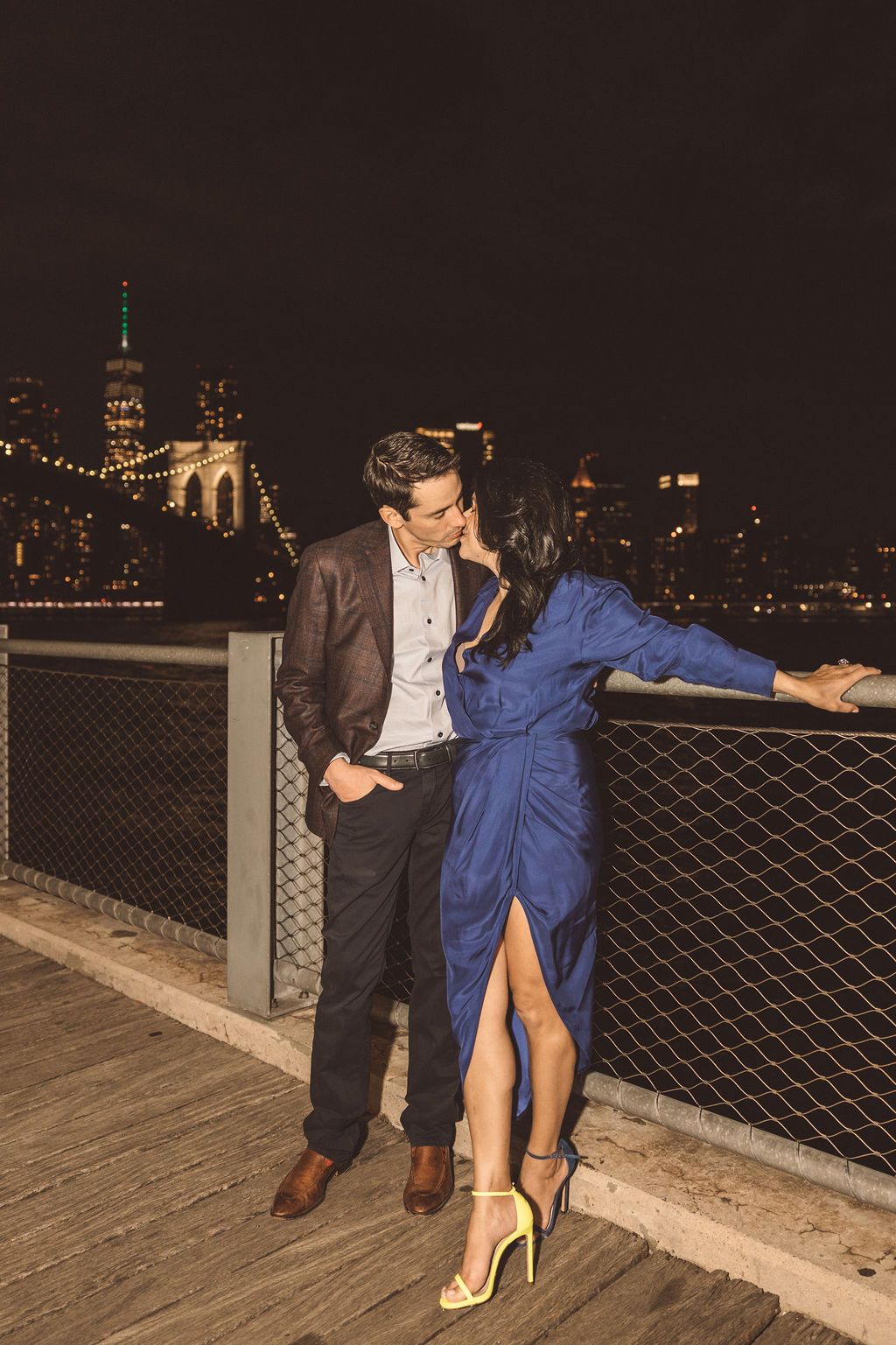 cute portrait of the newly engaged couple kissing