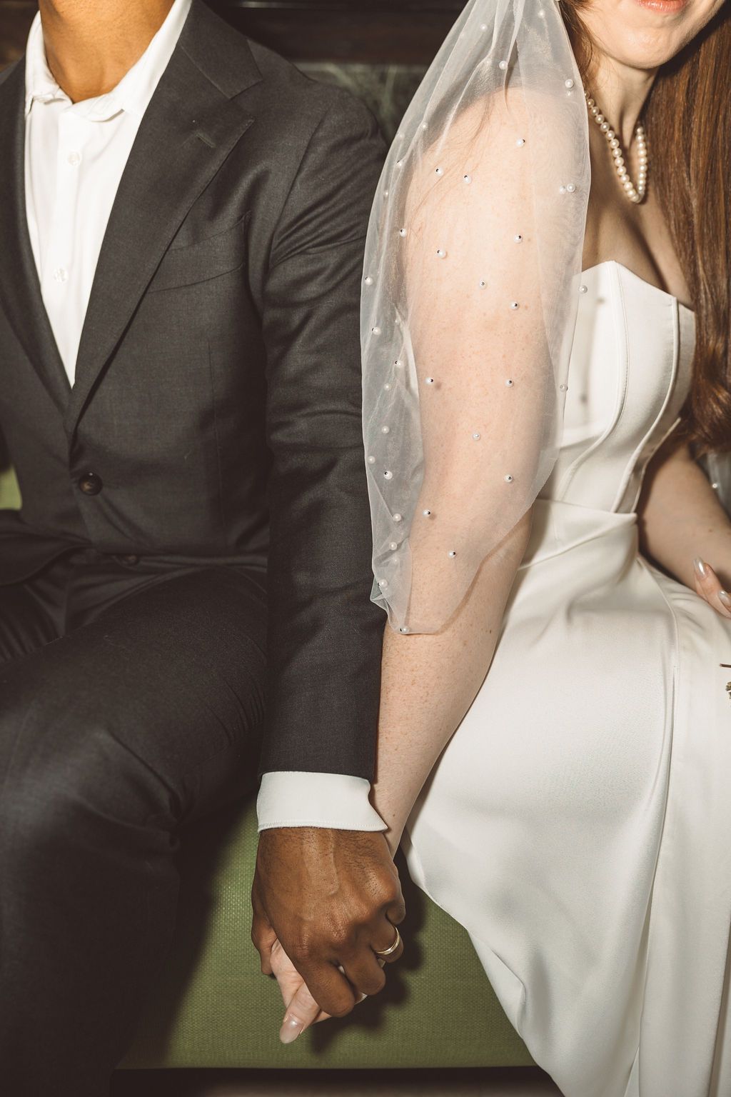 cute picture of the bride and groom holding hands