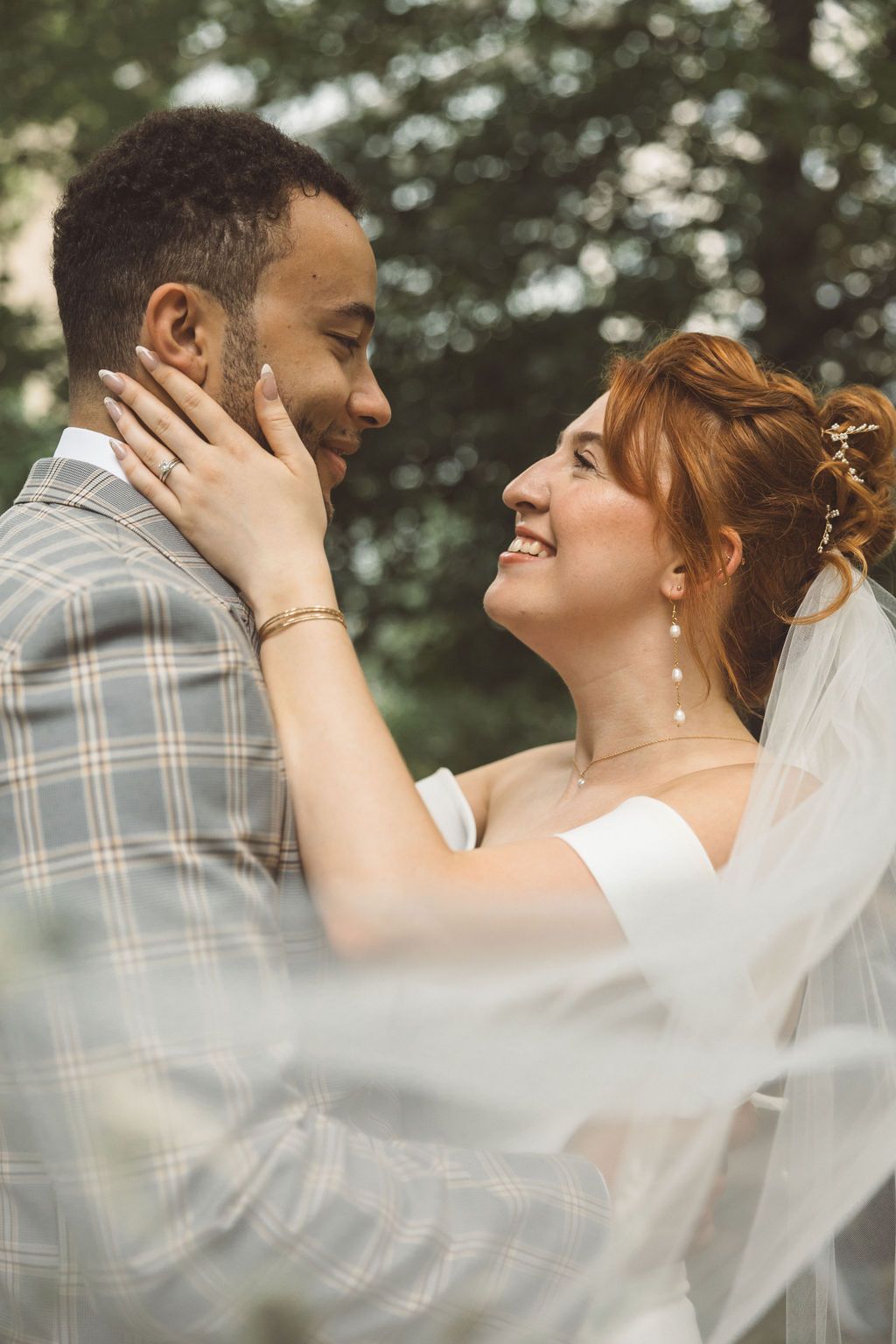 cute picture of the bride and groom laughing with each other