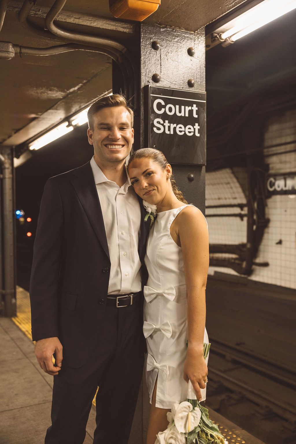 couple smiling at each other during their photoshoot
