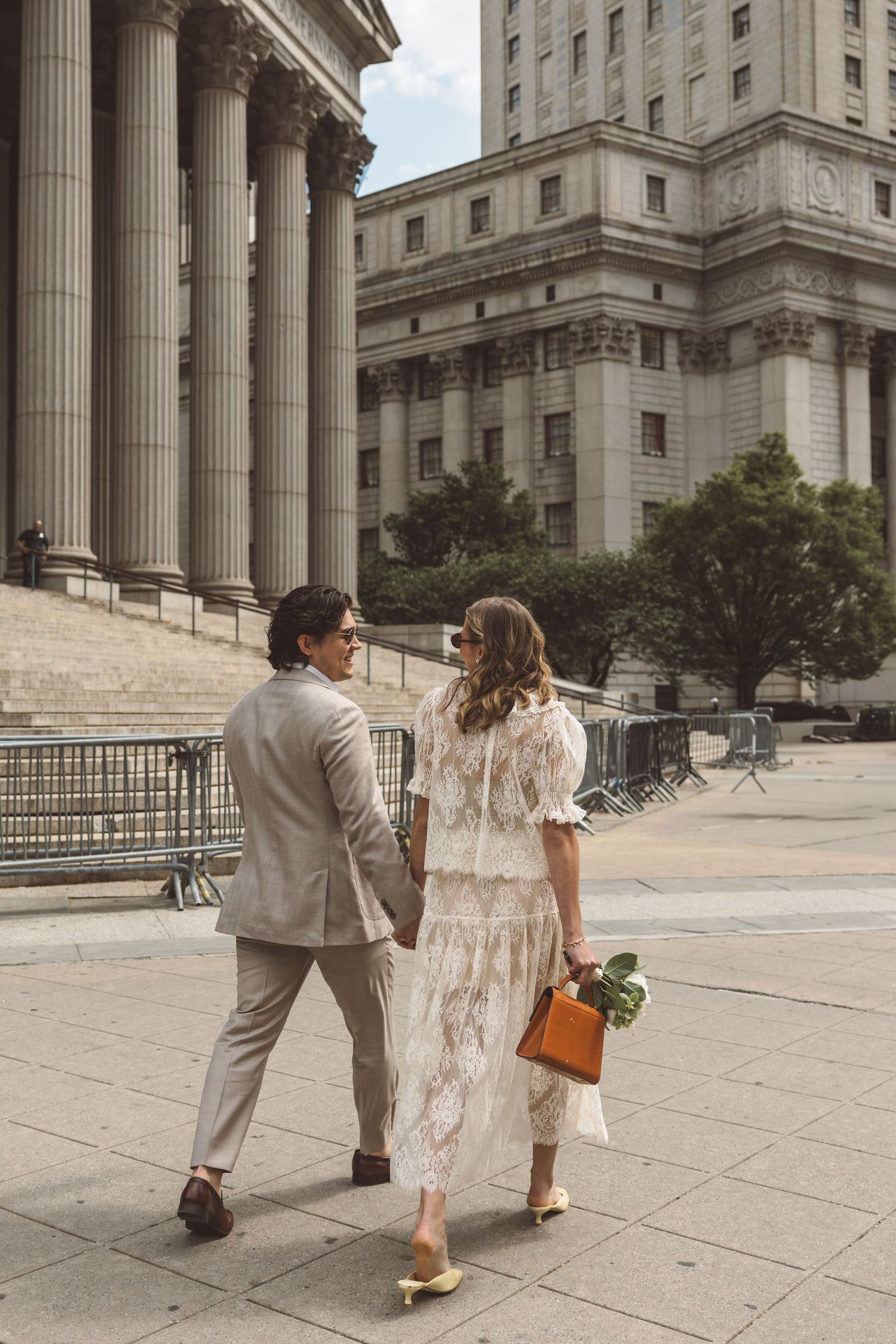 couple walking around NYC during their photoshoot