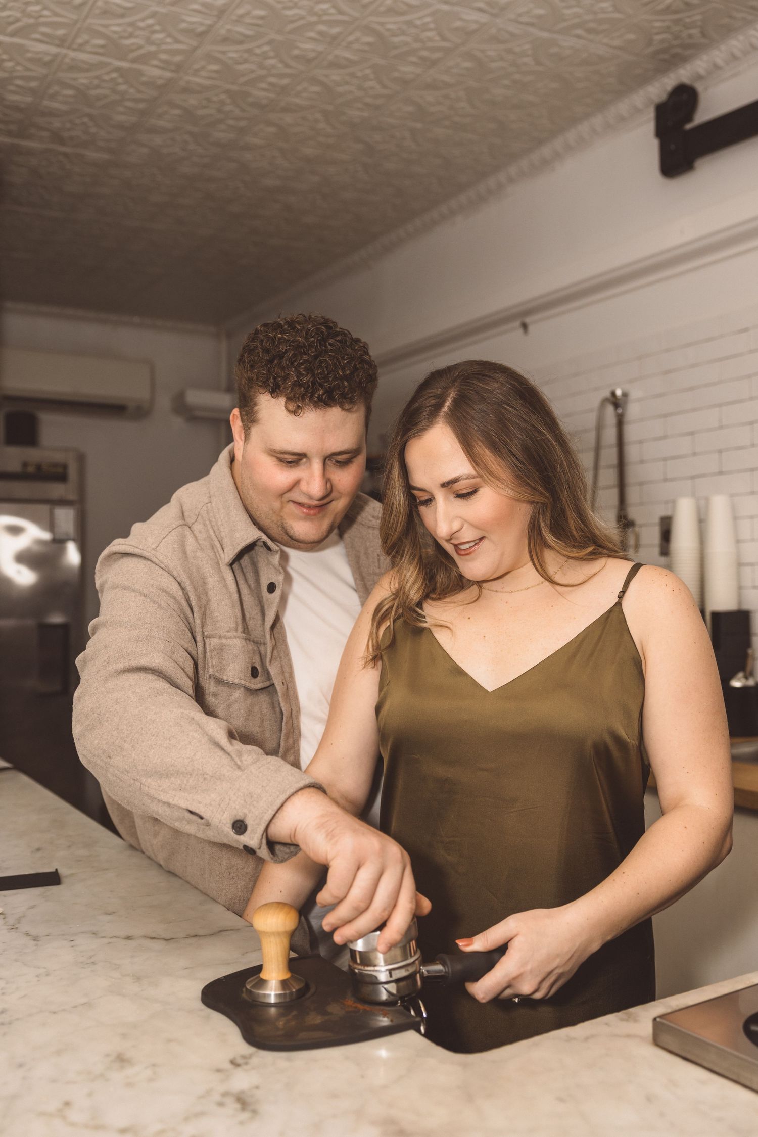 newly engaged couple at their favorite coffee shop