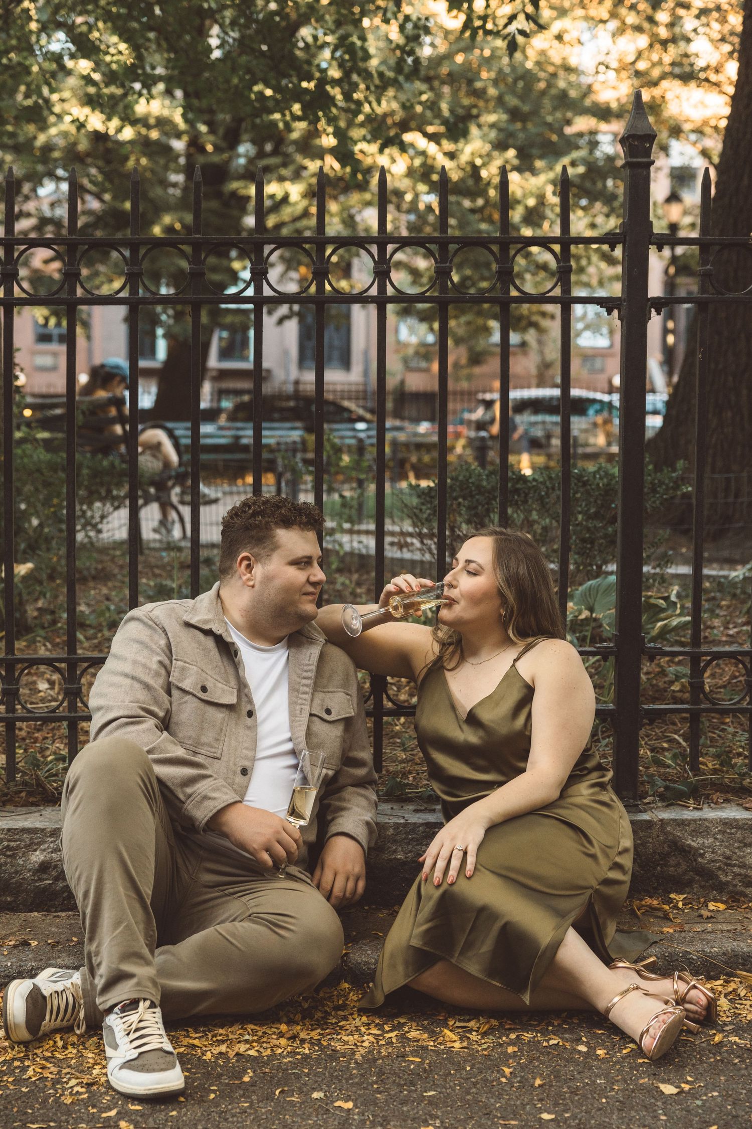 couple drinking champagne during their photoshoot