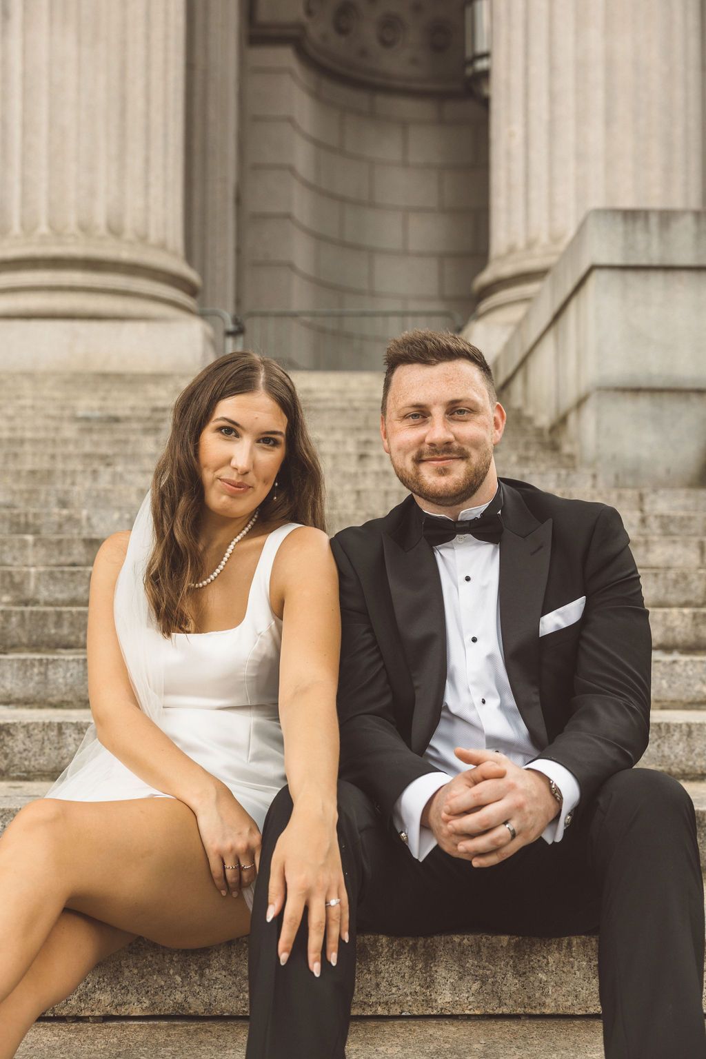 couple smiling at the camera during their photoshoot