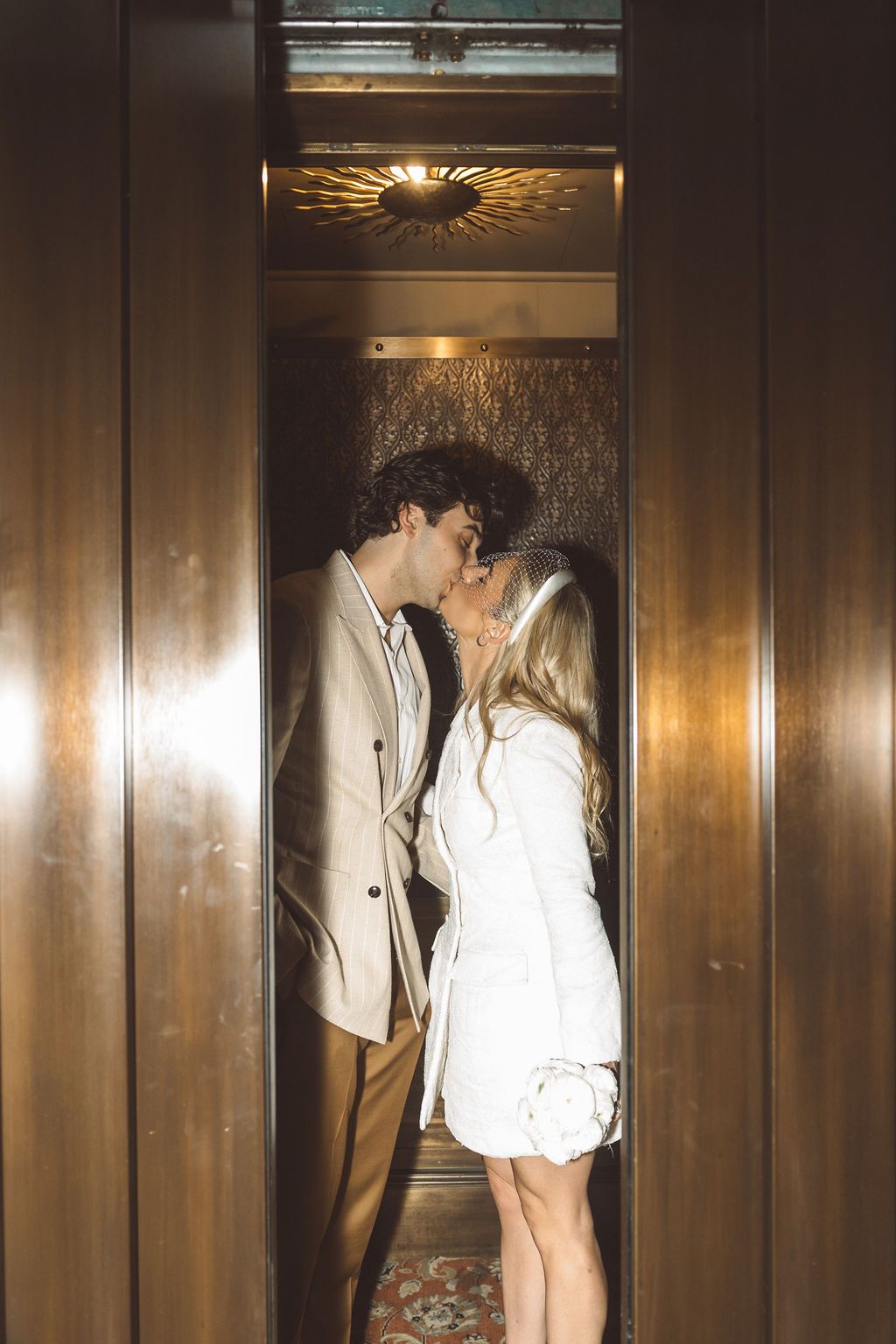 cute portrait of the newlyweds kissing