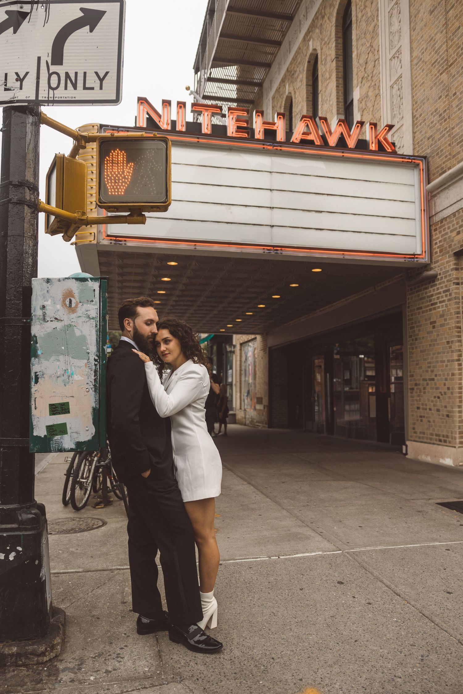 fiance kissing his fiance on the forehead