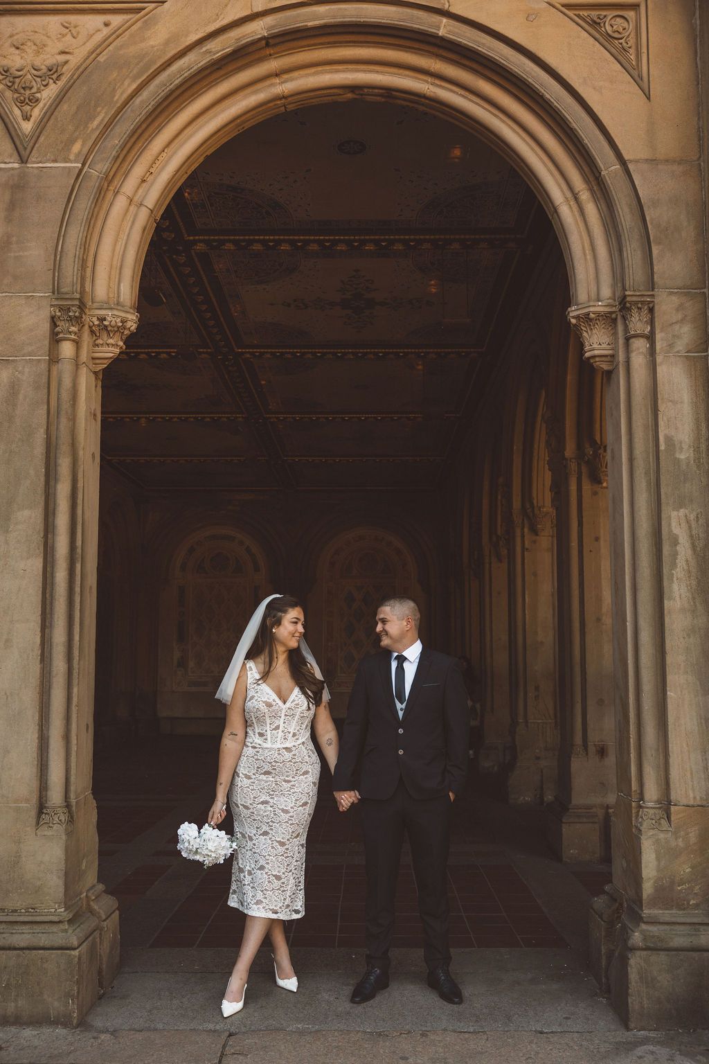 cute picture of the newlyweds smiling at each other