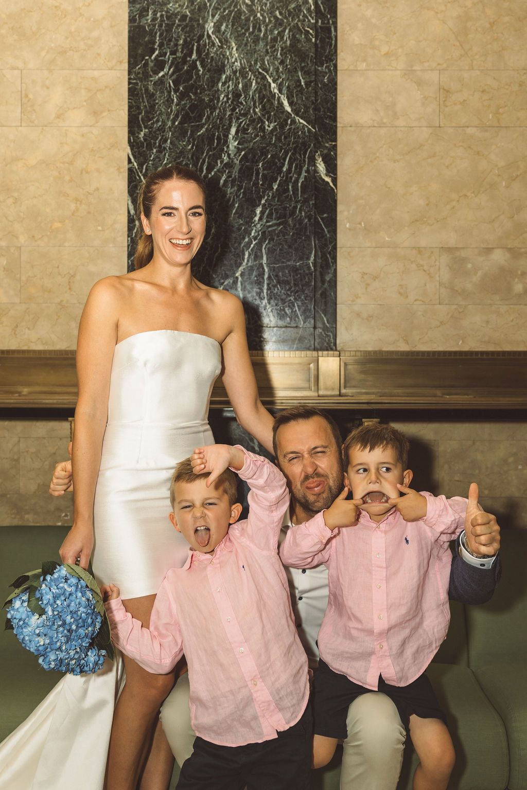 cute picture of the bride and groom with their kids